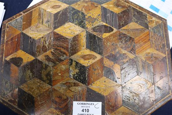 A Regency elongated octagonal games box, parquetry veneered, containing approximately 360 etched mother